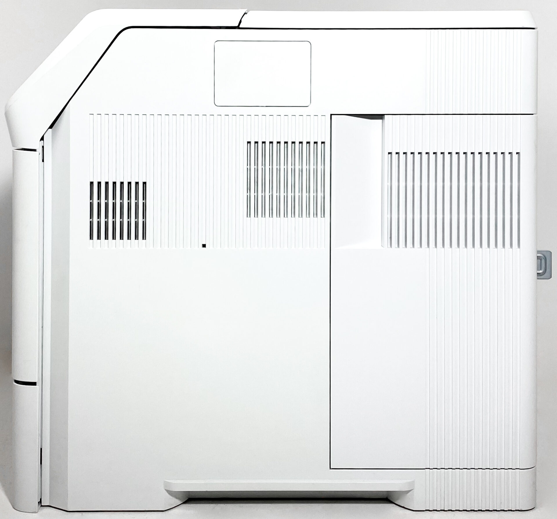 A large, white, rectangular HP LaserJet Enterprise M605n Laser Printer E6B69A with vertical vents and angular edges is displayed against a plain white background.